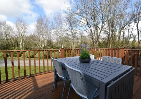 The decked patio & alfresco dining area at Passion Flower Cottage, Redberth