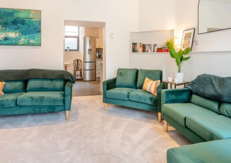 Pembroke House, Tenby is a beautifully presented six-bedroom retreat spread over four floors in the heart of this historic walled town, featuring a private courtyard garden, contemporary interiors, and easy access to South Beach and the harbour.