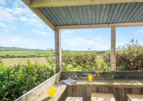 The decked terrace with outdoor bar at Pen Goppa, Bryncroes