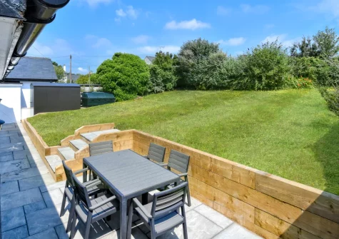 The patio, barbecue, alfresco dining area & enclosed lawned garden at Penduick, Abersoch