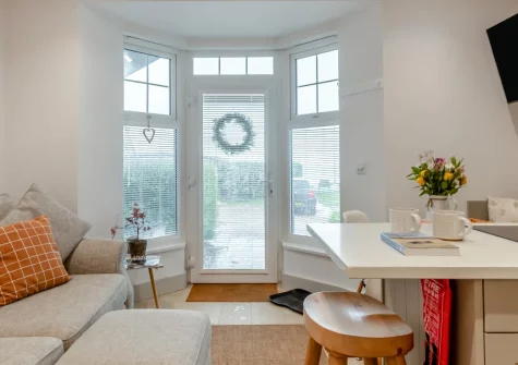 Penllanw, Saundersfoot is a delightful ground-floor beachfront apartment just metres from golden sands, featuring peaceful sea views, direct beach access from a shared lawn, and with the characterful harbour village right on your doorstep.