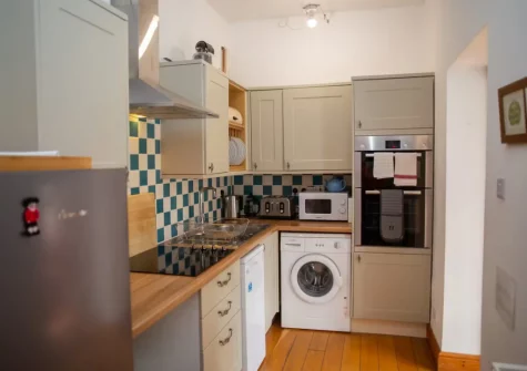 The kitchen at Pine Cottage at Woodlands Farm, Little Haven