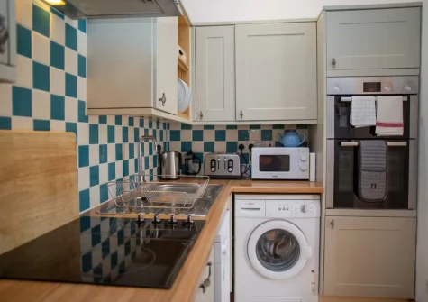 The kitchen at Pine Cottage at Woodlands Farm, Little Haven