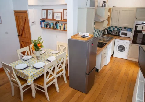The kitchen & dining area at Pine Cottage at Woodlands Farm, Little Haven