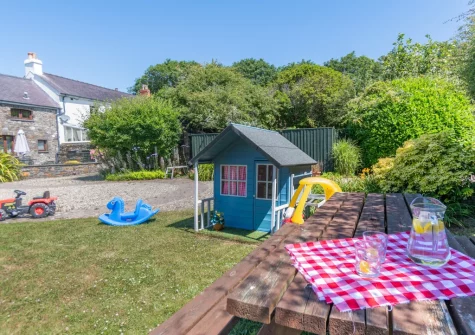 The shared children's play area, barbecue & alfresco dining area at Primrose Cottage, Haverfordwest