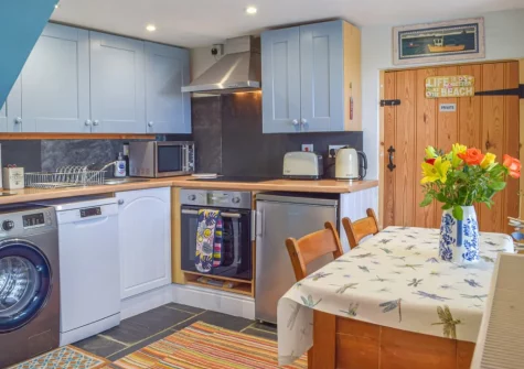 The kitchen & dining area at Puffin Cottage, Abereiddy