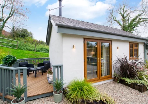 The decked patio, barbecue & outdoor siting area at Pwdin Bach, Rhydyclafdy