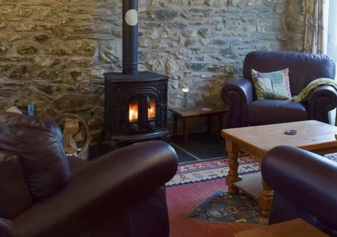 Ravens Roost at Upper Farm Barns, Mathry is a beautifully restored hay barn set in Pembrokeshire's National Park, featuring vaulted beamed ceilings, exposed stone walls, a cosy wood burner, and peaceful garden, close to dramatic coastal walks.