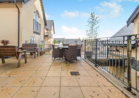 The shared patio & alfresco dining area at Rhodewood Apartment, Saundersfoot