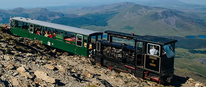 Britain's only public track and pinion mountain railway runs from Llanberis to the summit of Snowdon at 3,560ft, the highest mountain in England and Wales.