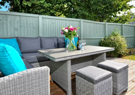 The decked patio, barbecue & alfresco dining area at Rockpools at 135 Cae Du, Abersoch