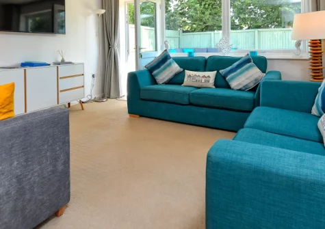 Rockpools, Abersoch is a stylish three-bedroom bungalow just a short distance from the beach, offering a private garden, parking, and coastal-chic interiors, perfectly placed for exploring the Llŷn Peninsula's beaches, village shops and coastal path.
