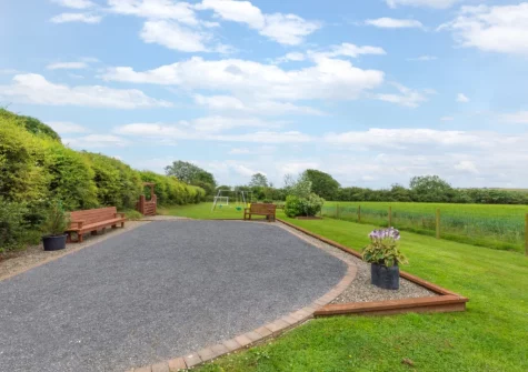 The shared garden, barbecue & children's play area at Rose Cottage, Haverfordwest