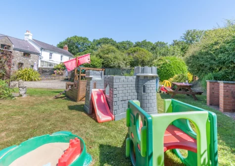 The shared garden, barbecue & children's play area at Rose Cottage, Haverfordwest