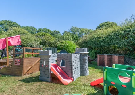 The shared garden, barbecue & children's play area at Rose Cottage, Haverfordwest