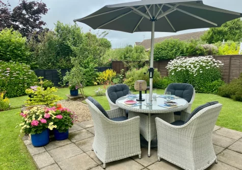 The patio, alfresco dining area & garden at Sandy Paws, Kilgetty