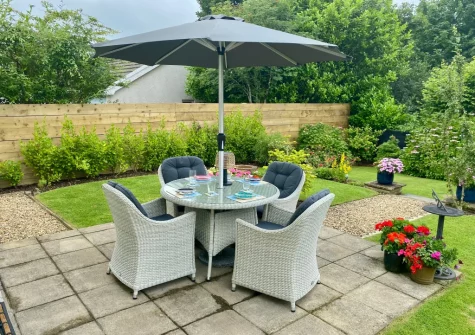 The patio, alfresco dining area & garden at Sandy Paws, Kilgetty
