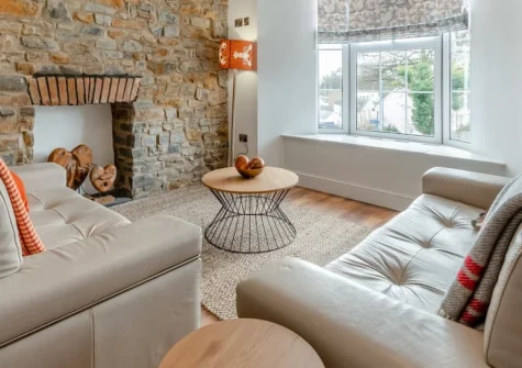 Sandy View at Harbour Heights, Saundersfoot is a luxurious two-bedroom apartment with sweeping sea views across Carmarthen Bay, elegant interiors featuring granite worksurfaces and spiral staircase, just a five-minute stroll from the beach.