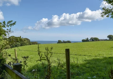The Bedroom #1 enjoys magnificent countryside views from the Juliet balcony at Sardis Cottage, Kilgetty
