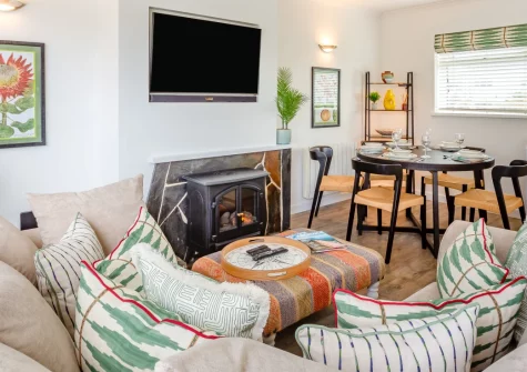 Sea Breeze, 40 Cae Du, Abersoch is a bright upside-down house on the popular Cae Du estate, featuring a sunny balcony, contemporary open-plan living, and prime access to Abersoch's golden beaches and the stunning Llyn Peninsula coastline.