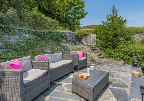 The three-level terraced garden & outdoor sitting area at Sea Thrift, Aberdovey