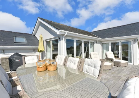 The expansive wrap-around sundeck & alfresco dining area at Seabreeze, Abersoch