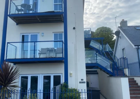 Seabreeze is accessed via outside steps up to the first-floor entrance.