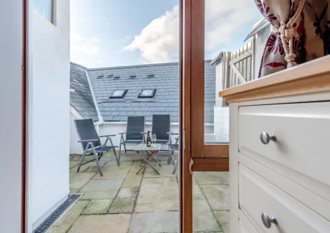 Accessed from the master bedroom, the first-floor courtyard & outdoor sitting area at Seaglass, Little Haven