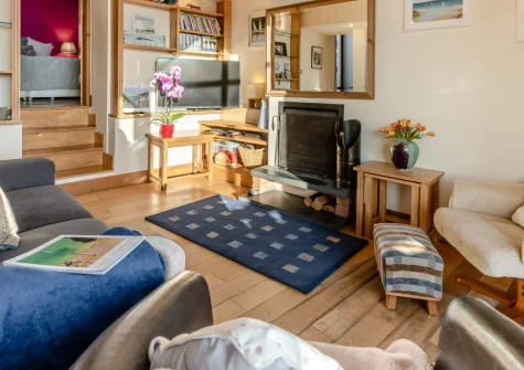 Seaglass, Little Haven is a charming three-bedroom cottage just 50 metres from one of Wales's cleanest beaches, featuring a loft-style lounge with panoramic sea views, private courtyard, and direct access to the Pembrokeshire Coast Path.