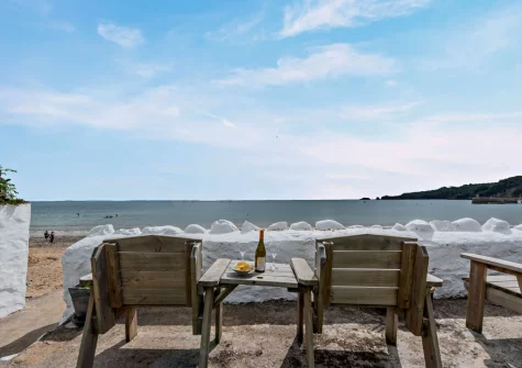 The shared outdoor sitting area overlooking the beach at Seashells, Saundersfoot