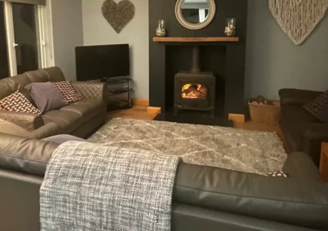 Seren y Mor, Freshwater East is a fabulous four-bedroom house perched on sand dunes with spectacular sea views from every room, featuring a wood burner, luxurious interiors, and direct access to the beautiful beach just moments away.