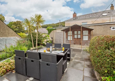 The patio, alfresco dining area & raised gravelled garden at Siop Newydd, Llanengan