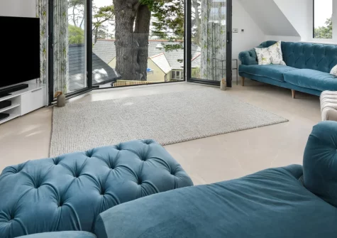 Skylark, Abersoch is a luxurious four-bedroom retreat with sea views from its first-floor balcony, a private hot tub nestled in landscaped gardens, cutting-edge entertainment systems, and electric gates, all just moments from Blue Flag beaches.