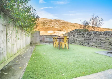The rear garden, barbecue & alfresco dining area at Slate Trail Retreat, Cwm Penmachno