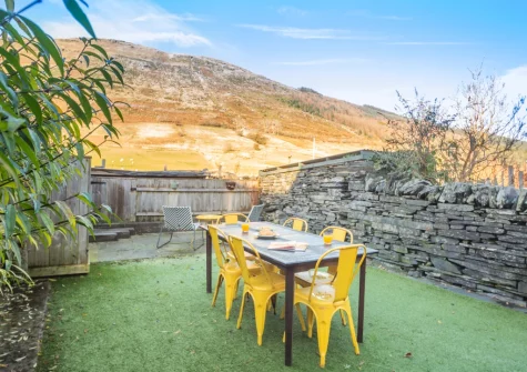 The rear garden, barbecue & alfresco dining area at Slate Trail Retreat, Cwm Penmachno