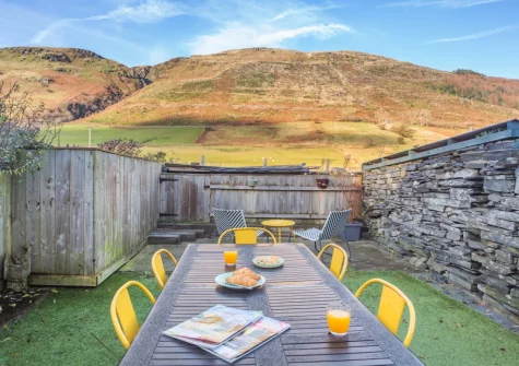 The rear garden, barbecue & alfresco dining area at Slate Trail Retreat, Cwm Penmachno