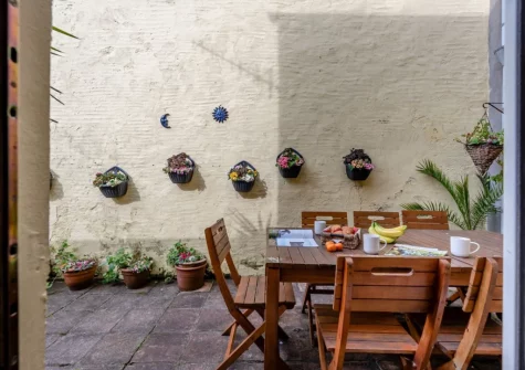 The enclosed courtyard & alfresco dining area at Somerville, Tenby