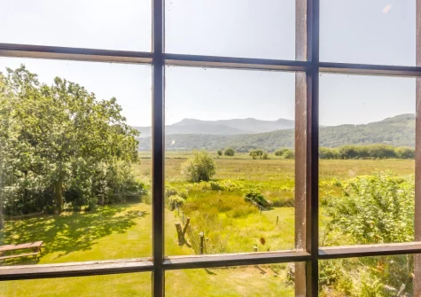 The stunning countryside view from the living area at Sounds of the Brook, Llanelltyd