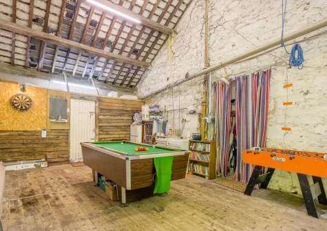 The games barn, with a 7' pub sized pool table, table tennis, darts board & table football, at Sounds of the Brook, Llanelltyd