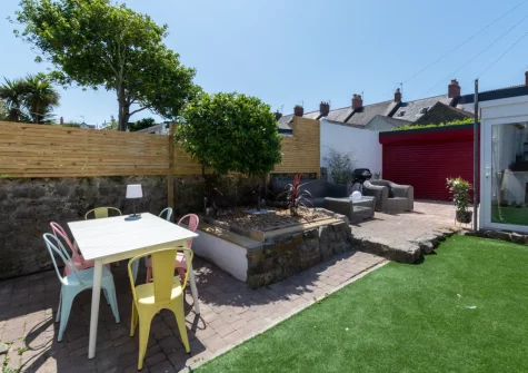 The patio, alfresco dining, outdoor sitting area & garden at South Beach Cottage, Tenby