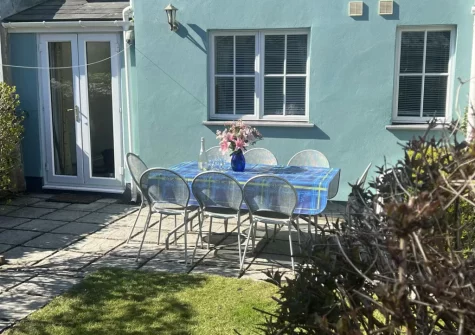 The sunny rear garden with patio & alfresco dining area at South Seas, Tenby