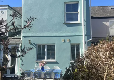 The sunny rear garden with patio & alfresco dining area at South Seas, Tenby