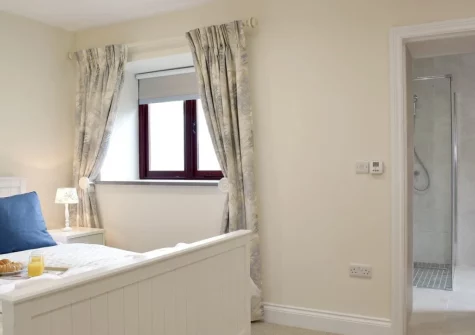 Bedroom #1 & en-suite shower room at Southlands Barn, Saundersfoot