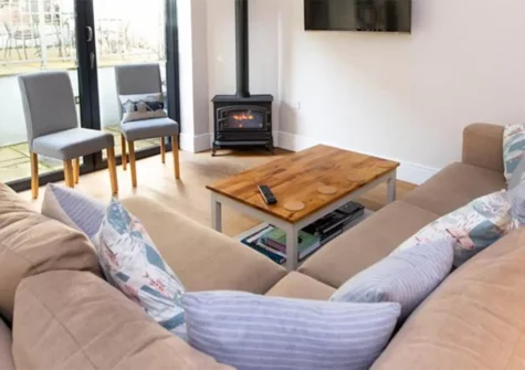 Southsea House, Tenby is a contemporary three-storey townhouse close to beaches, offering a modern interior, five bedrooms, a terrace with historic views, and easy access to local attractions. Close to Paragon Beach, it's ideal for group holidays.