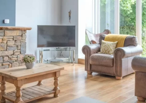 Stella Maris, Freshwater East is a spectacular four-bedroom house on the sand dunes above the bay, featuring cathedral ceilings, panoramic sea views through a vast apex window, extensive outdoor spaces with BBQ hut, and direct access to the beach.