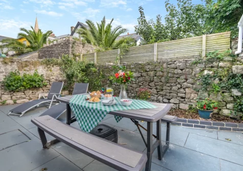The enclosed patio garden & alfresco dining area at Stretton House, Tenby