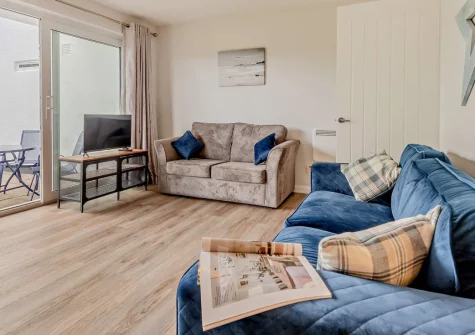 Summer Breeze, Saundersfoot is a peaceful ground-floor apartment just 500 metres from the village's Blue Flag beach, featuring a private enclosed patio, flexible open-plan living with sofa bed, and easy access to Pembrokeshire's stunning coastline.