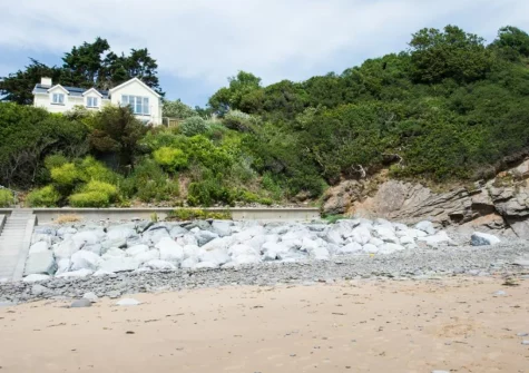 A path leads directly from the property that meanders along the coastline and leads right onto Coppet Hall Beach