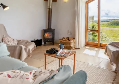 Sunset Cottage, Trefasser is an eco-friendly retreat on a Pembrokeshire smallholding, featuring sea views, unforgettable sunsets, acres of meadows and woodland to explore, and direct footpath access to the dramatic coastal paths just beyond.