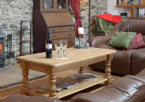 Swallow Lodge at Upper Farms Barns, Mathry is a beautifully restored dairy barn in the Pembrokeshire Coast National Park, featuring vaulted beamed ceilings, exposed stone walls, a cosy wood burner, and easy access to golden beaches and St Davids.